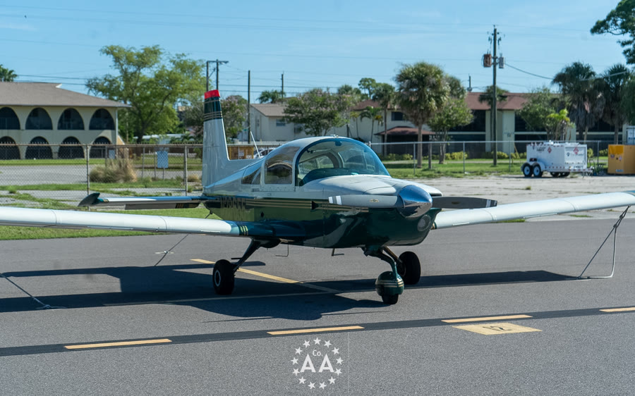 Grumman AA-5B Tiger trainer tied down on the ramp, one of the airplanes used for flight training at Alpha Company Aviation